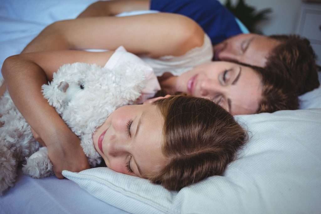 Family sleeping peacefully.