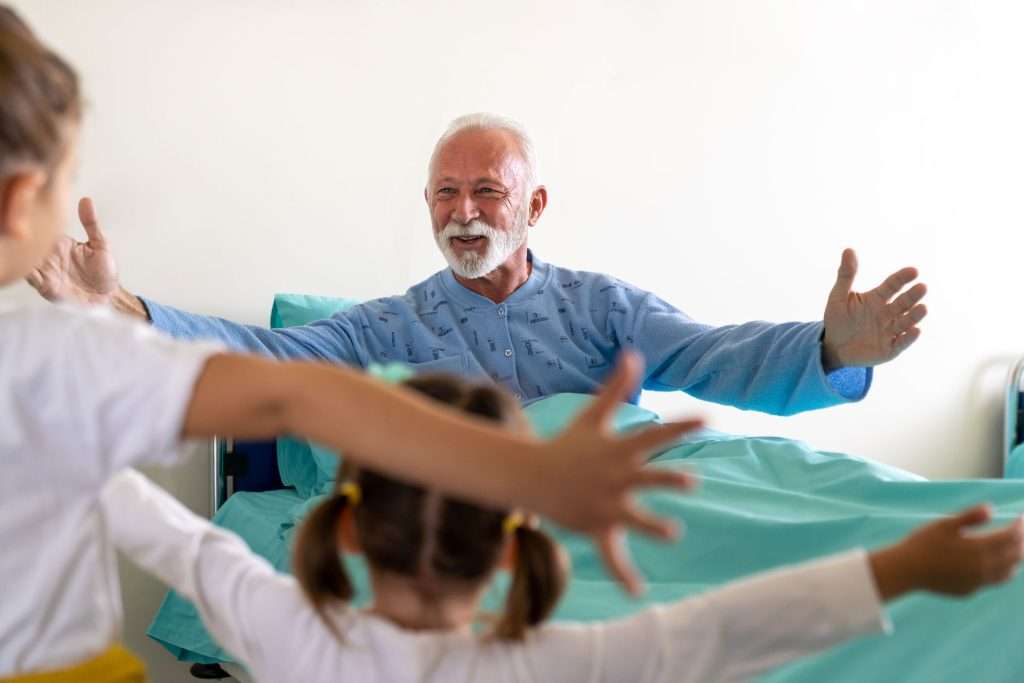 Grandchildren visiting their grandfather.
