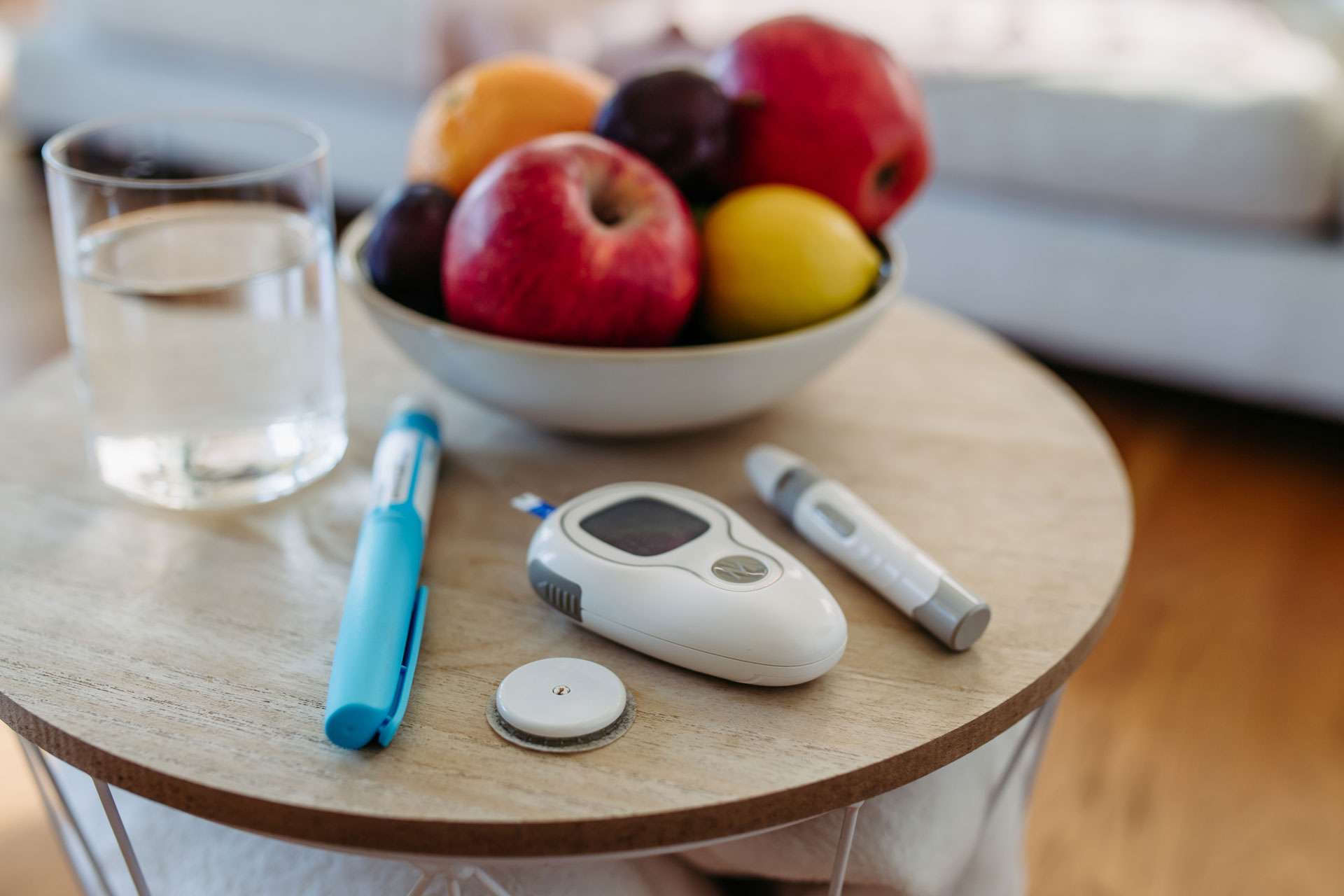 Diabetes supplies and devices on table.