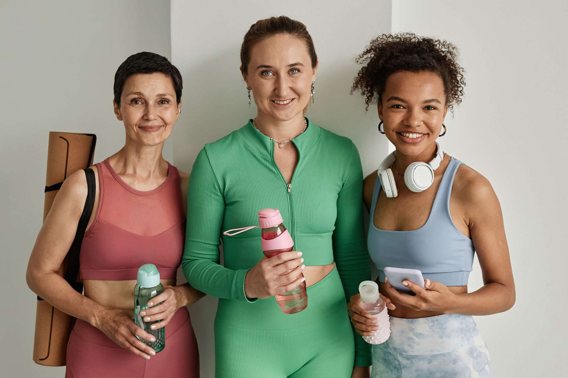 Women in different age wearing workout clothes.