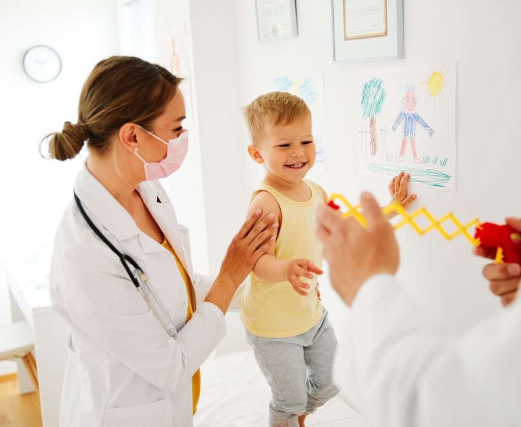 Pediatrician doing a well-child check-up.