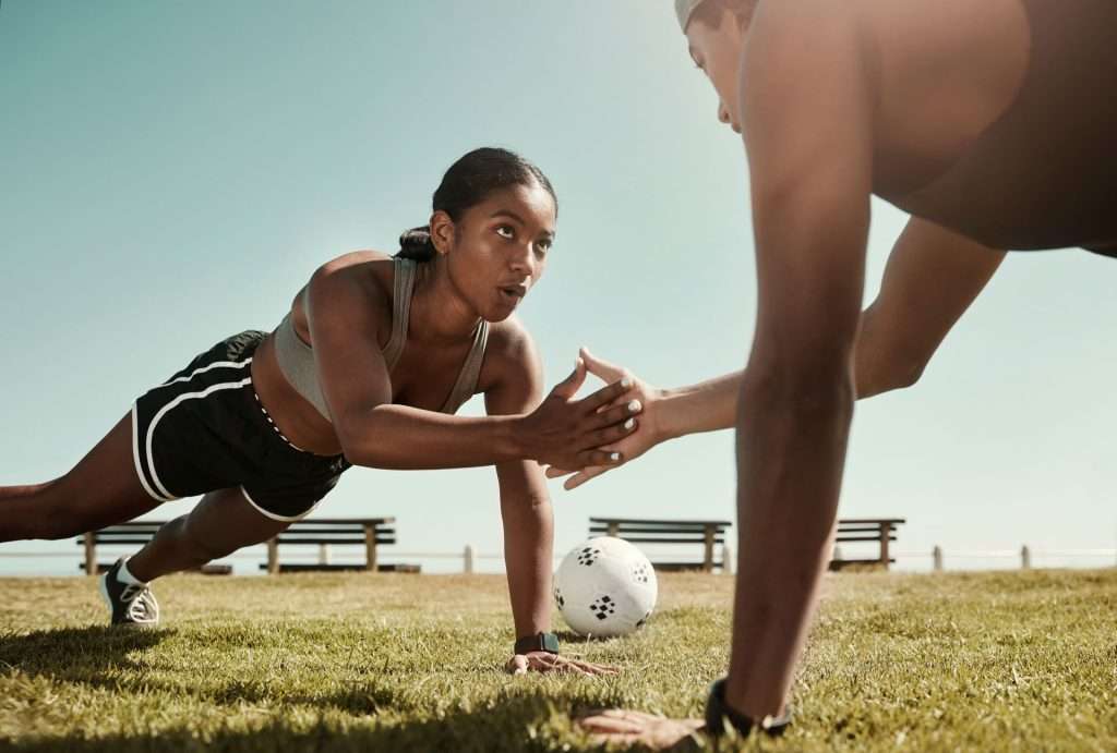 Fit couple exercising.