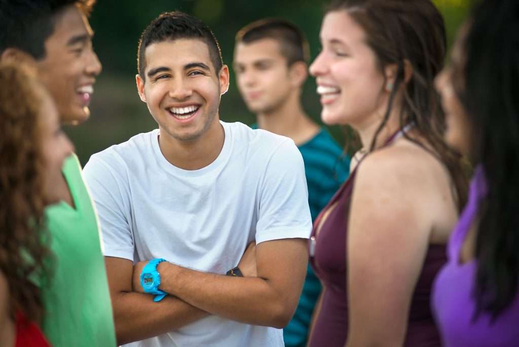 Group of young friends smiling.