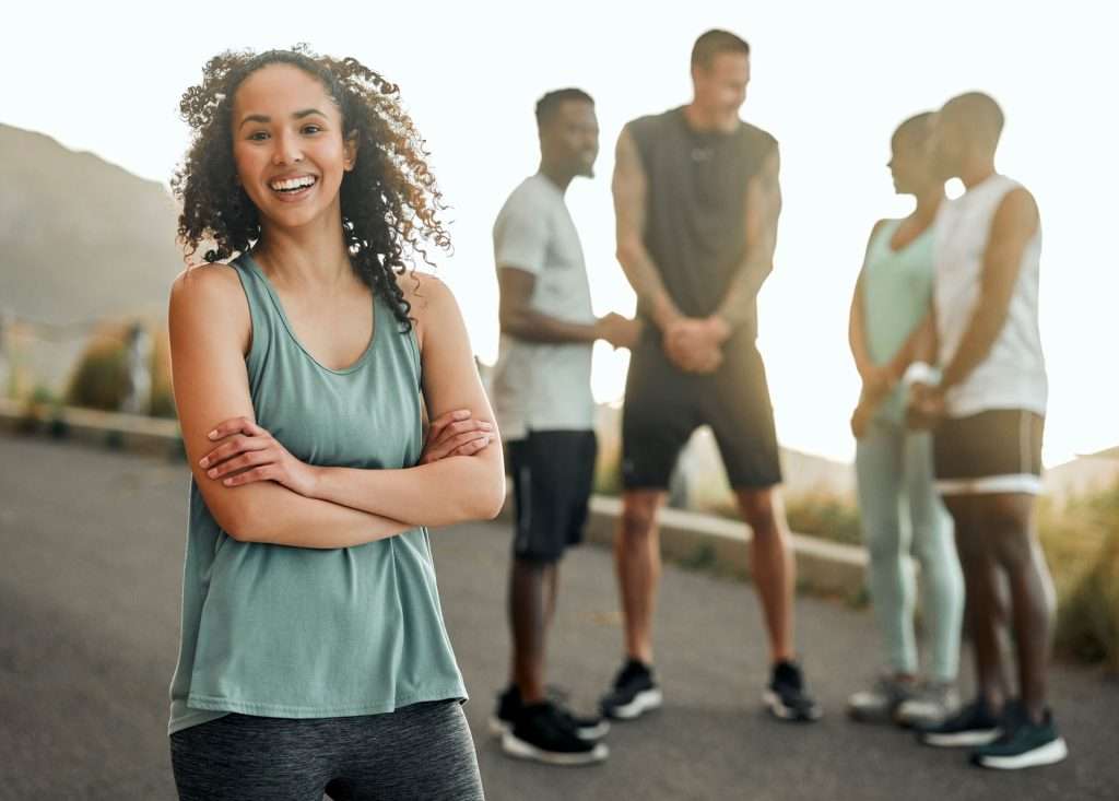Group of friends exercising outdoors.
