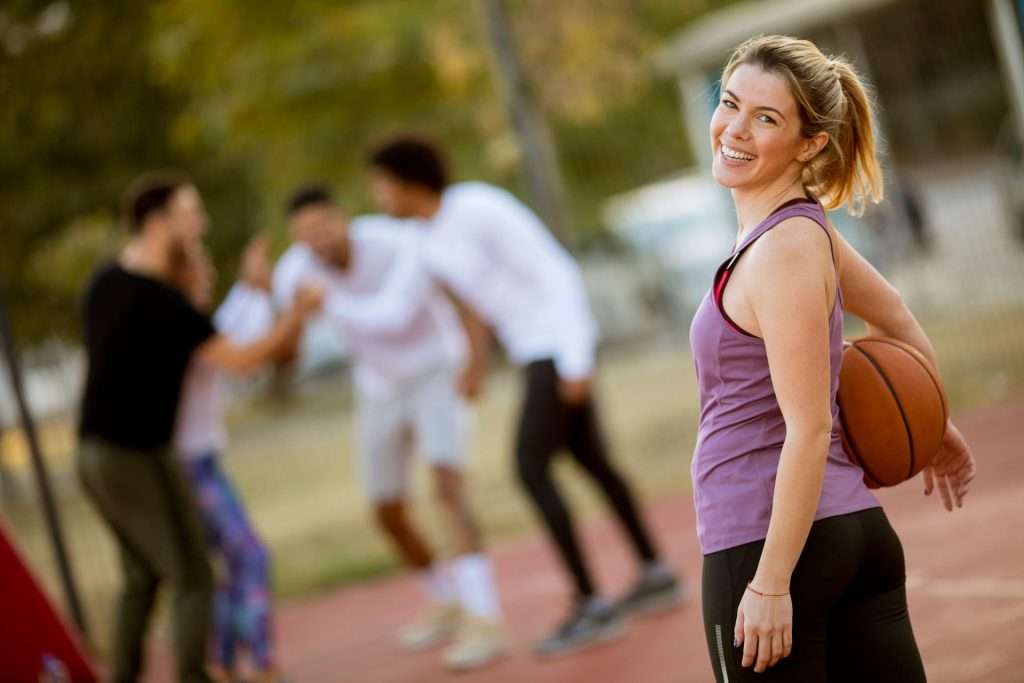 Young woman in basketball park.