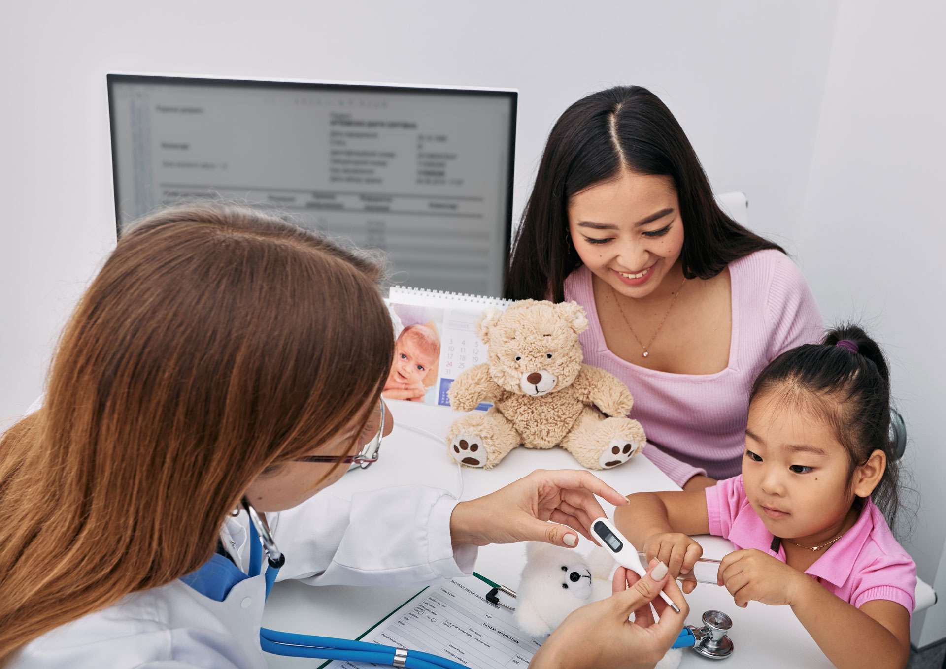 Mother with daughter checkup with the doctor.
