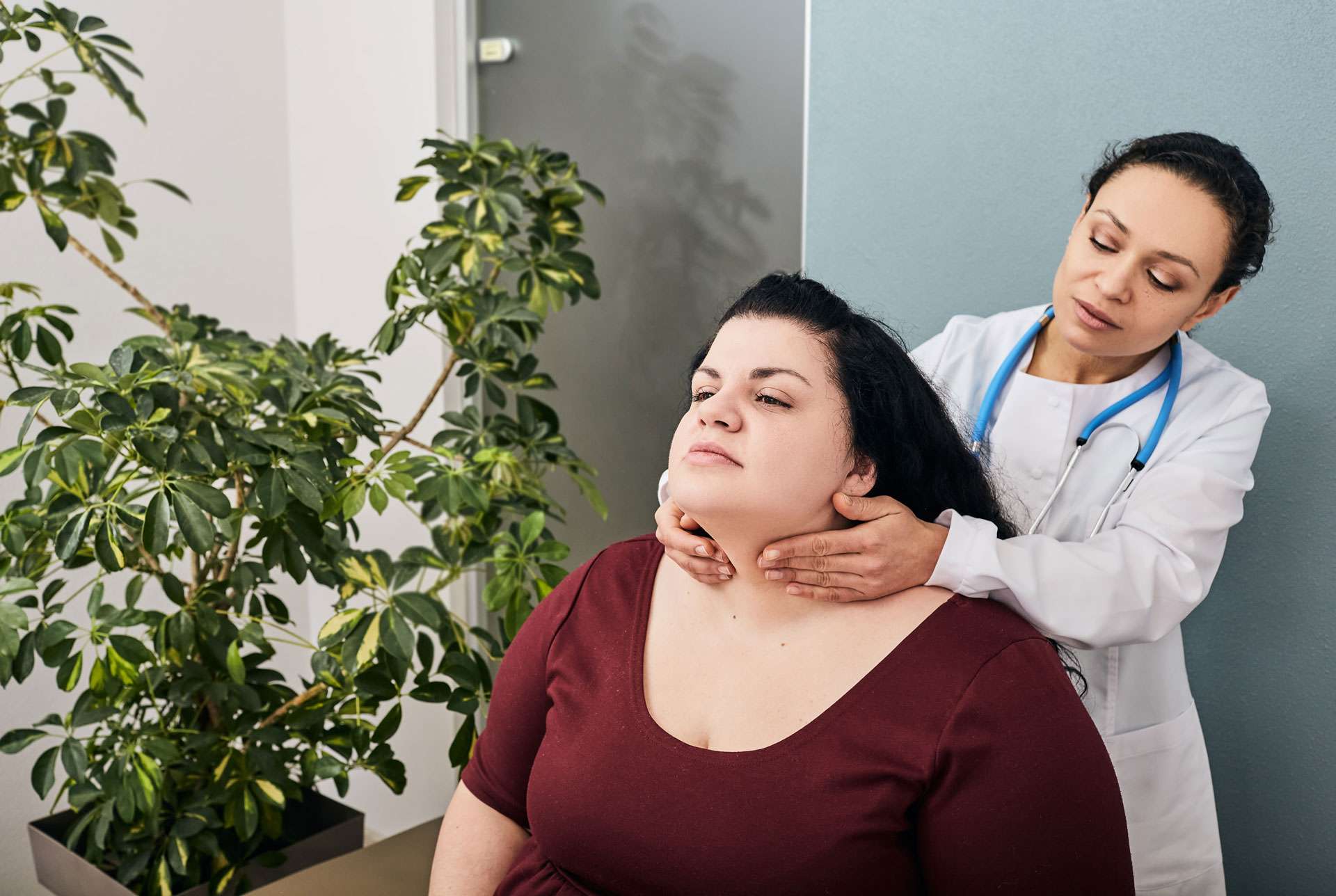 Female doctor doing a regular checkup for a woman with possible chronic disease.