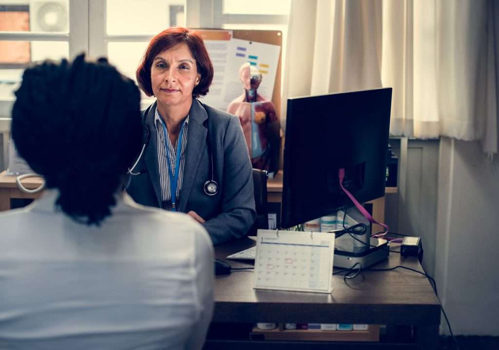 Doctor talking to a person.