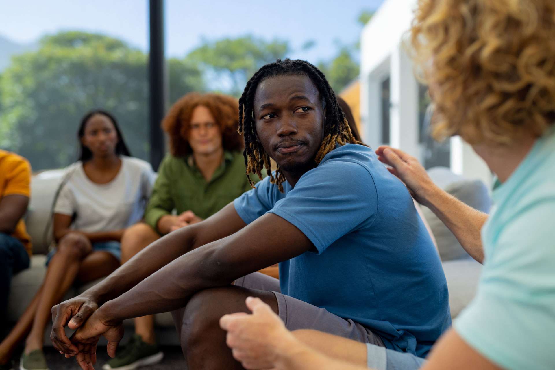 Group of diverse people sitting and talking.