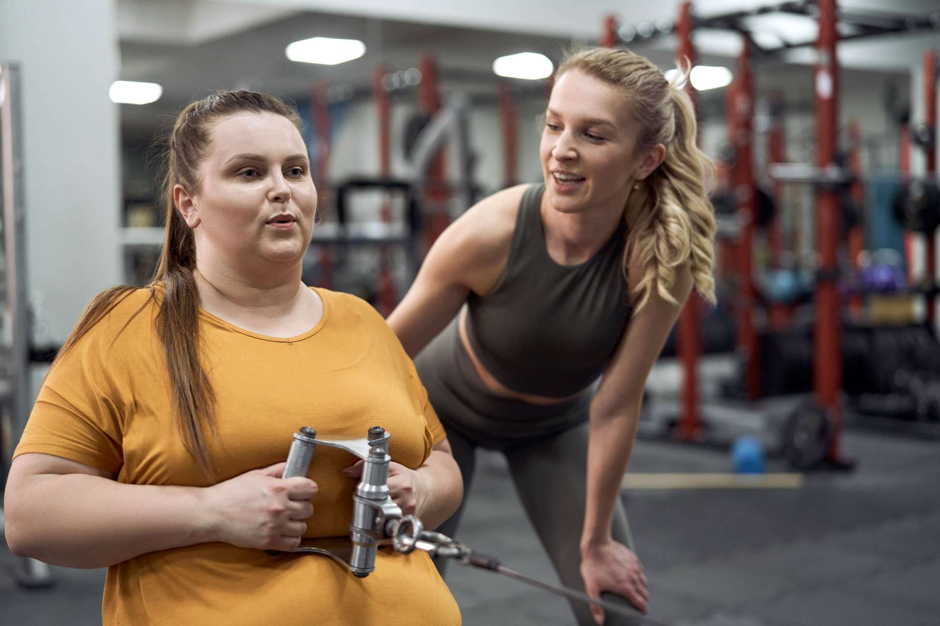 Plus-size woman with her trainer.