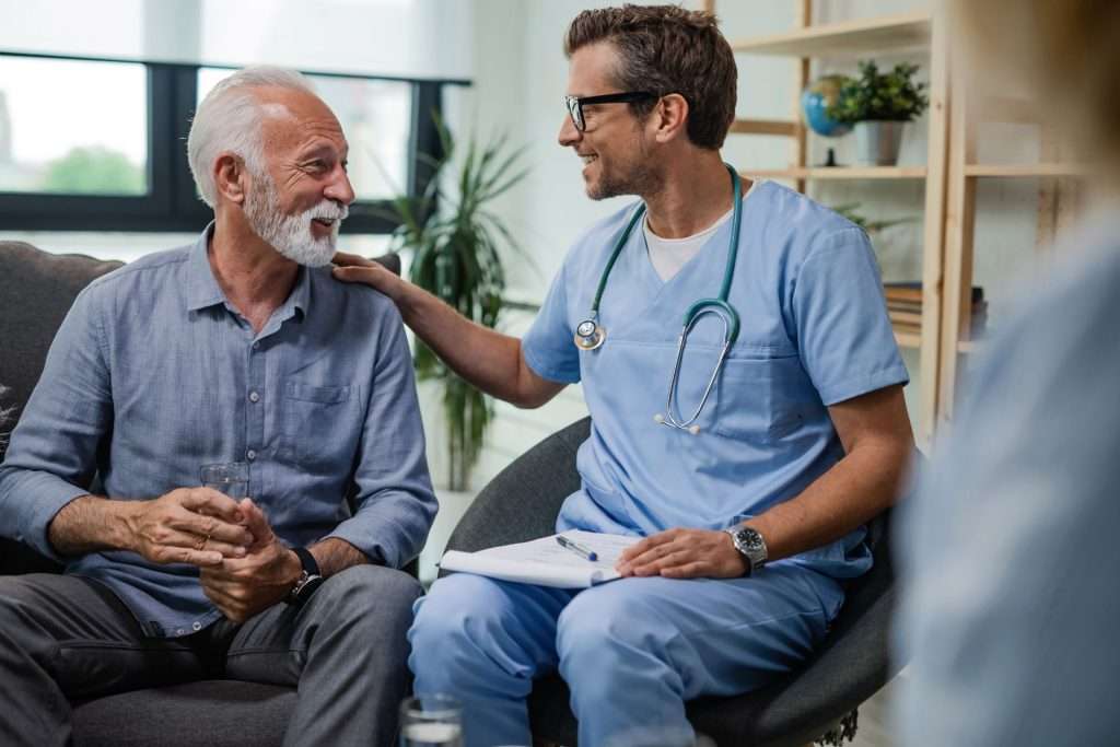 Doctor managing geriatric health of an elderly man.