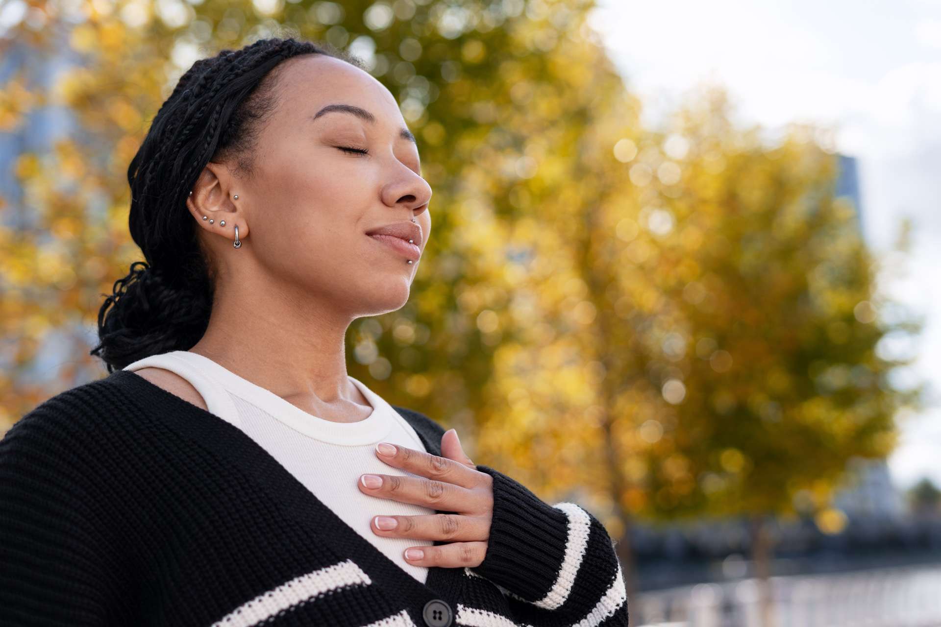 Young beautiful African woman breathing.
