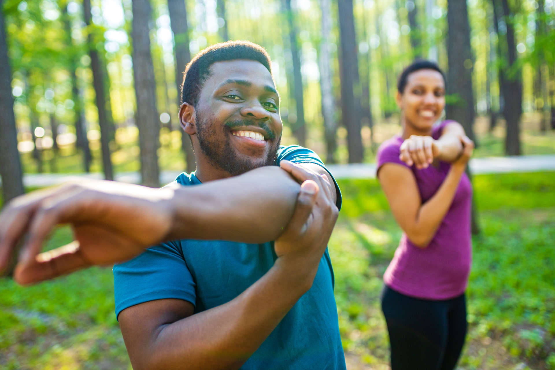 Adult couple stretching.